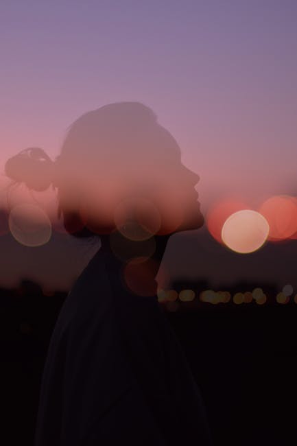 Artistic silhouette with double exposure and bokeh at sunset, creating a dreamy effect.