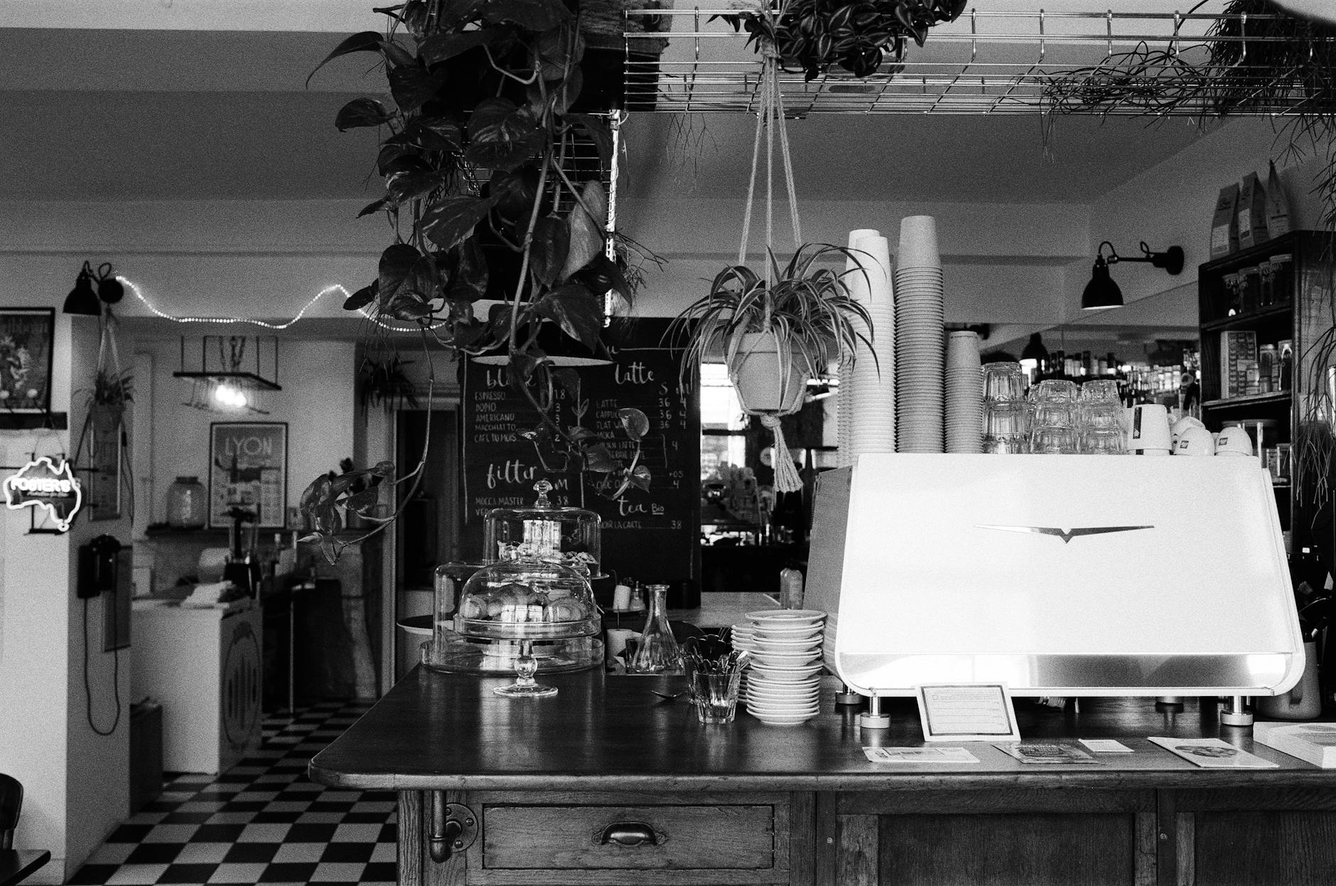 Coffee Bar Organizers With Glass Jars, Wooden Trays, And A Chalkboard Menu