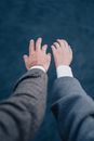 Hands Wearing Wedding Rings Reaching Out