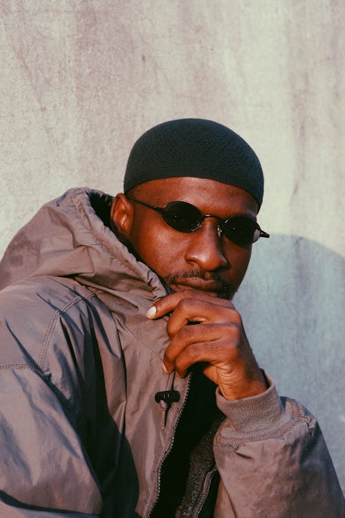 Man Posing in Sunglasses and in a Jacket 