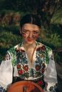Woman Wearing Folk Costume with Embroidered Shirt