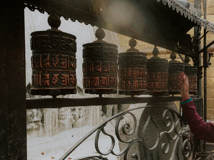 A Person Spinning Prayer Wheels 