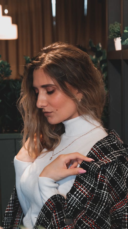 A Woman in White Turtleneck Sweater