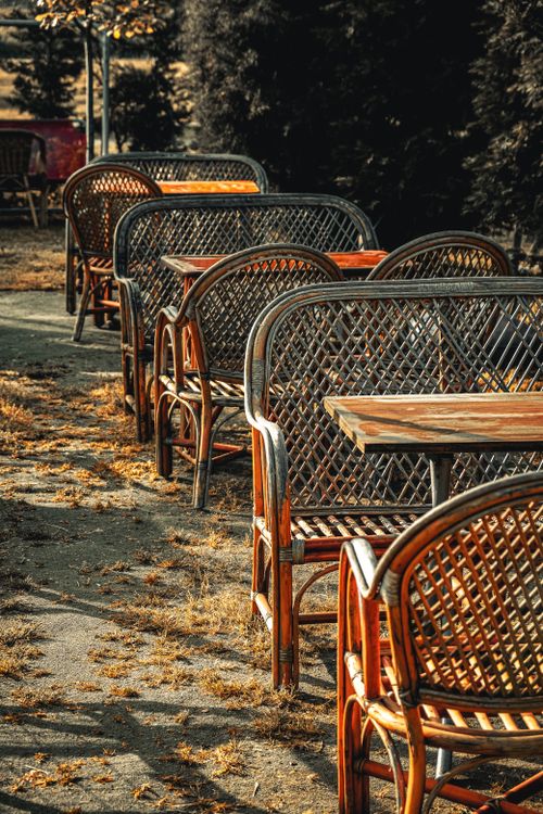 Free Sunlit rattan chairs in a charming Istanbul cafe setting, perfect for a cozy gathering. Stock Photo