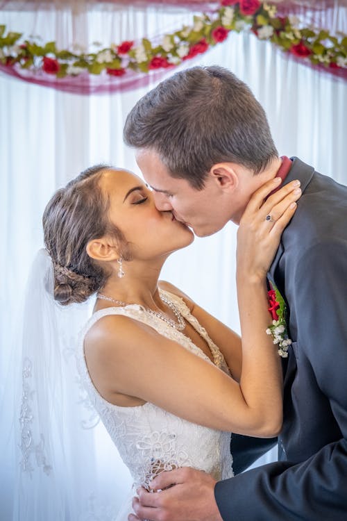A Bride and Groom Kissing