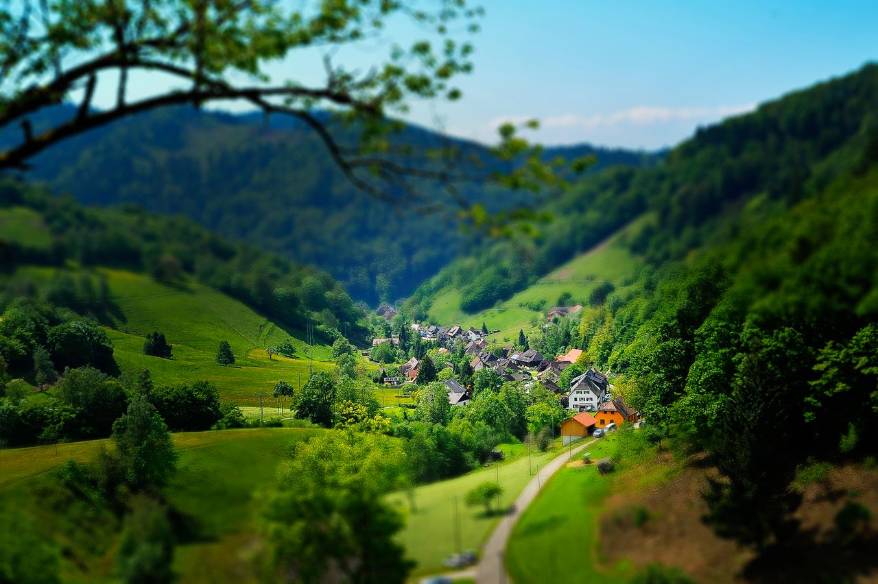 charming countryside village nestled in a lush green valley under a br