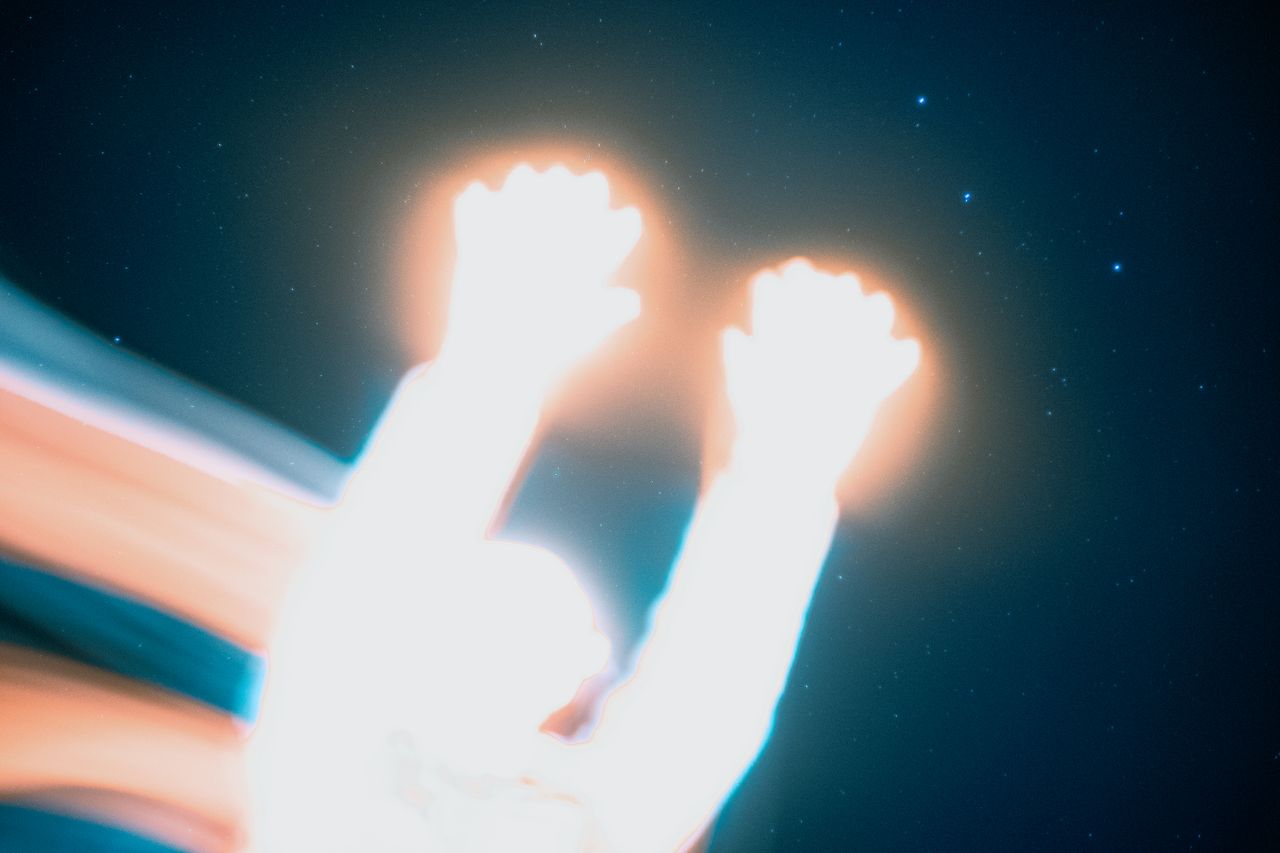 creative long exposure shot featuring abstract light painting and a st