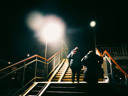 People Walking on the Stairs