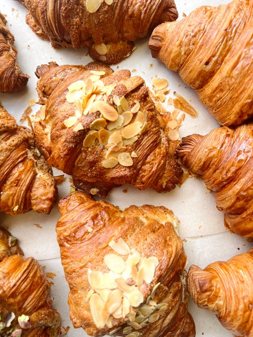 Free Tempting almond-topped croissants showcasing golden layers. Stock Photo