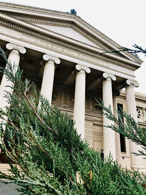 Free Majestic columns and detailed facade of a neoclassical building in Athens, Greece. Stock Photo