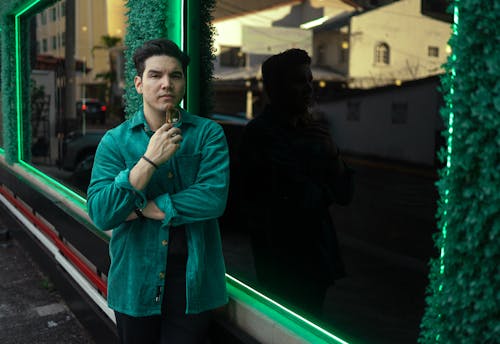 A Man in Blue Jacket Looking at the Camera