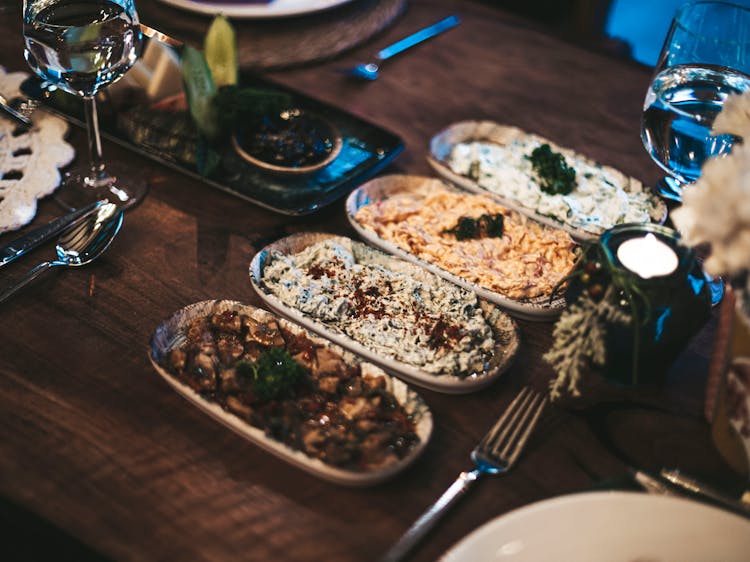 Variety Of Cooked Food Served On Plates