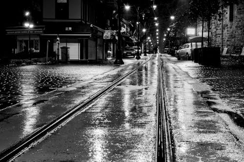 Free Grayscale Photo of a Wet Road at Night Stock Photo