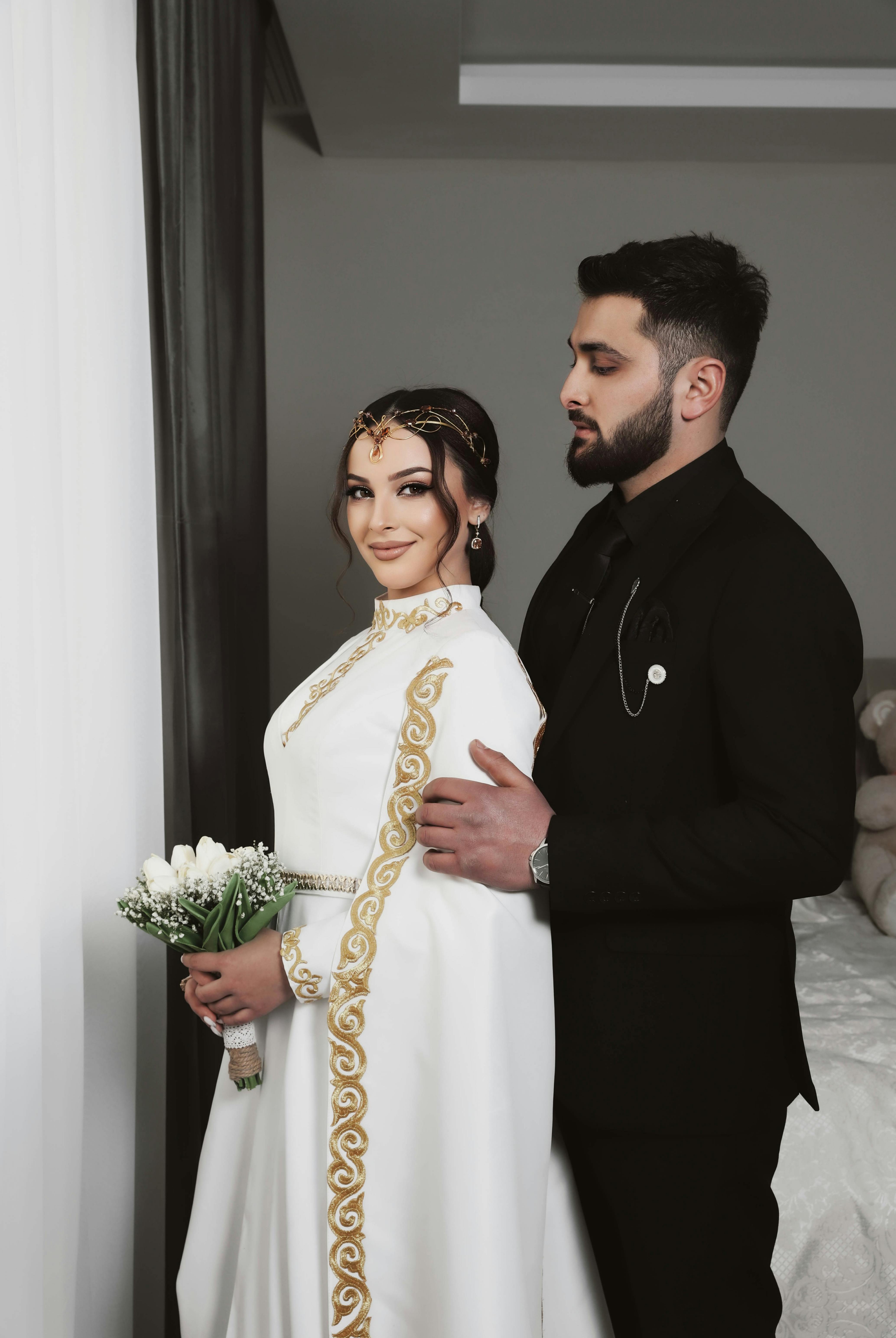 Bride and groom in traditional attire during a wedding photoshoot