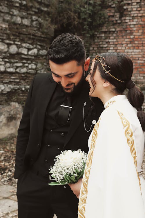 Bride and Groom talking on Wedding Day 