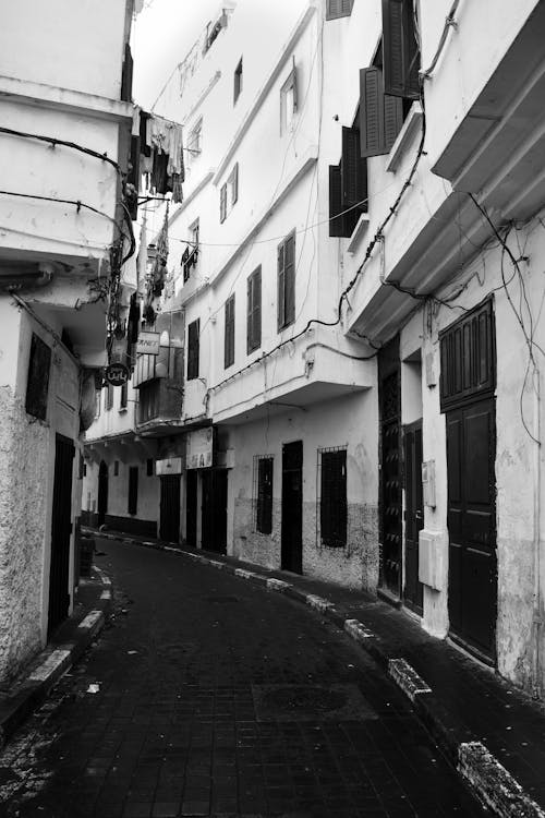 Black and White Photo of a Narrow Street