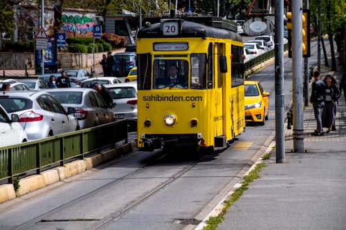 A Yellow Tram on the Railway