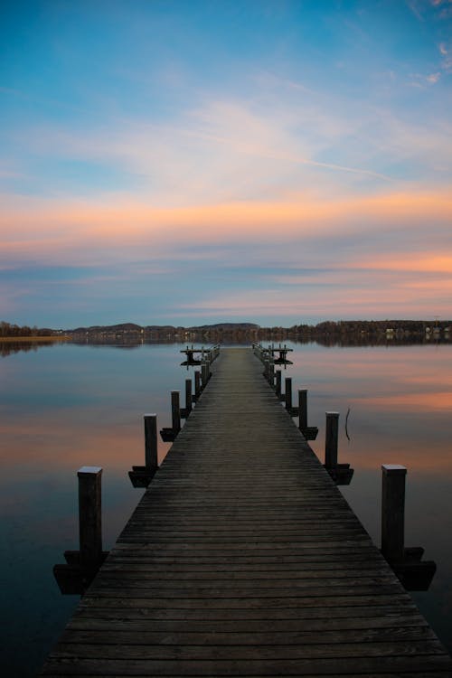 Wooden Dock on Lake During Dawn