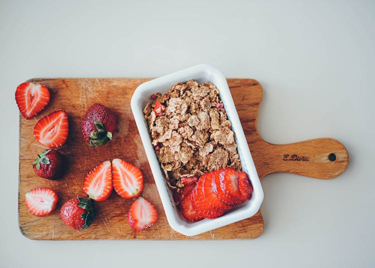 Sliced Strawberries On White Ceramic Bowl