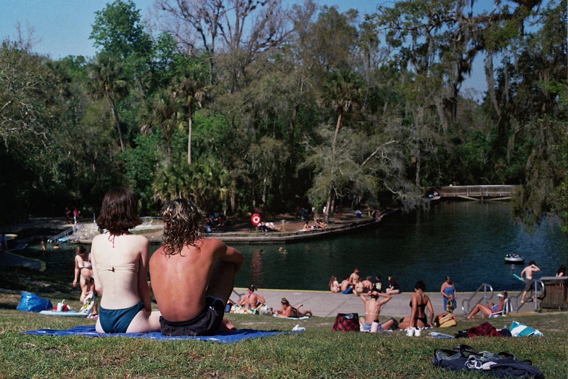 People Sitting Near the Lake