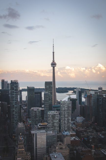 Scenic aerial view of Toronto's skyline showcasing the iconic CN Tower during the day.