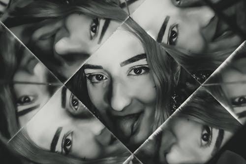 Free Multiple Reflections of Woman's Face Stock Photo