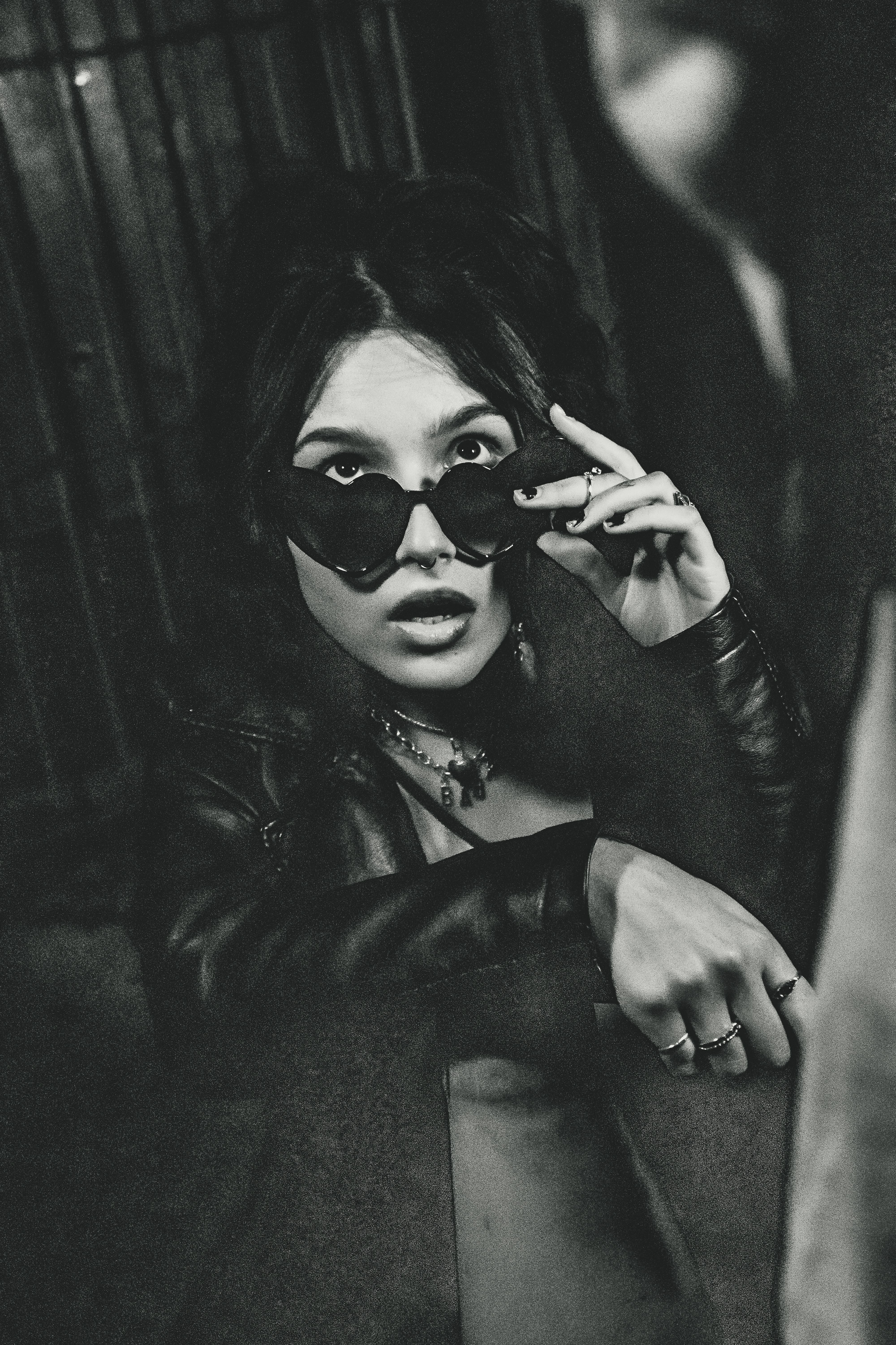 A Woman in Black Leather Jacket Wearing Black Sunglasses · Free Stock Photo