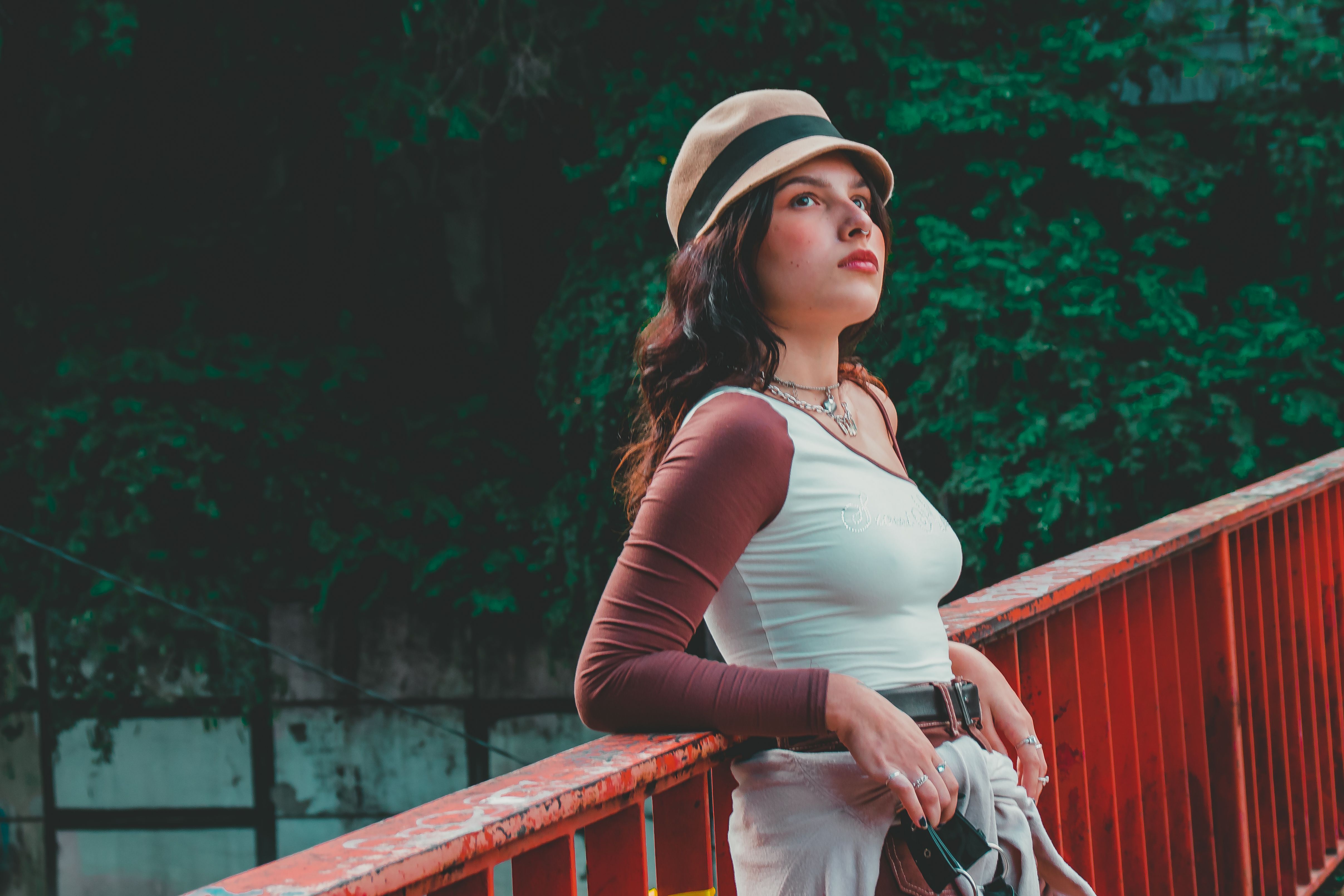 A Woman in Red and White Long Sleeve Shirt Wearing Brown Hat · Free ...
