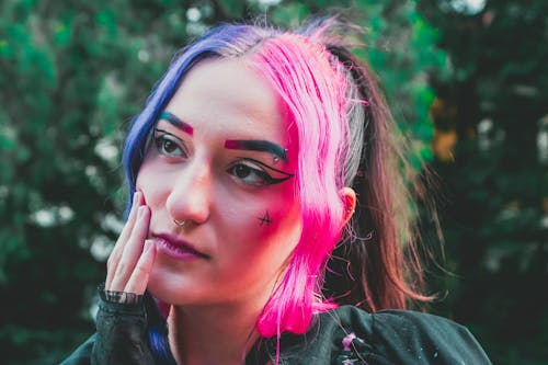 Close-up Photo of Stylish Woman with Pink hair 