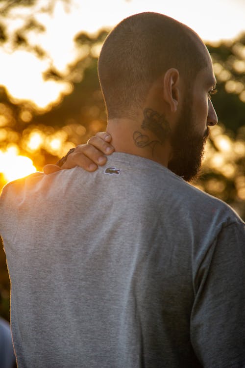 
A Bearded Man with a Tattoo on His Neck