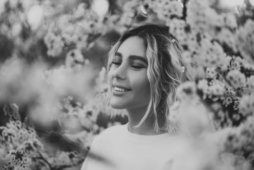 Black and White Photo of a Woman in White Crew Neck Shirt