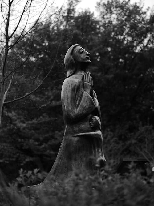 Grayscale Photo of Woman Statue