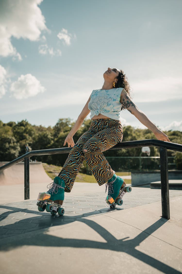 A Woman Wearing Roller Skates In The Skate Park