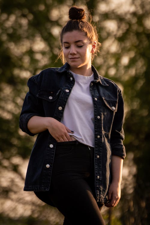 A Woman in Black Denim Button Up Jacket