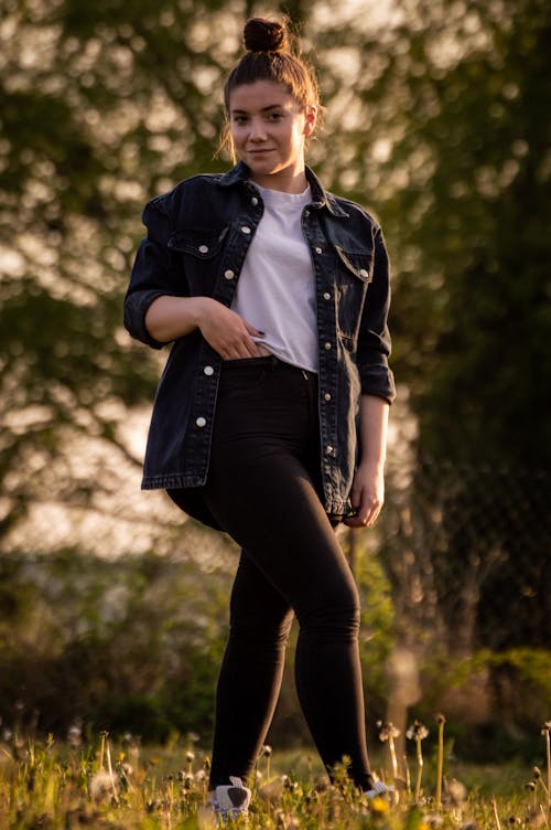 Free Woman in Denim Jacket and Black Pants  Stock Photo