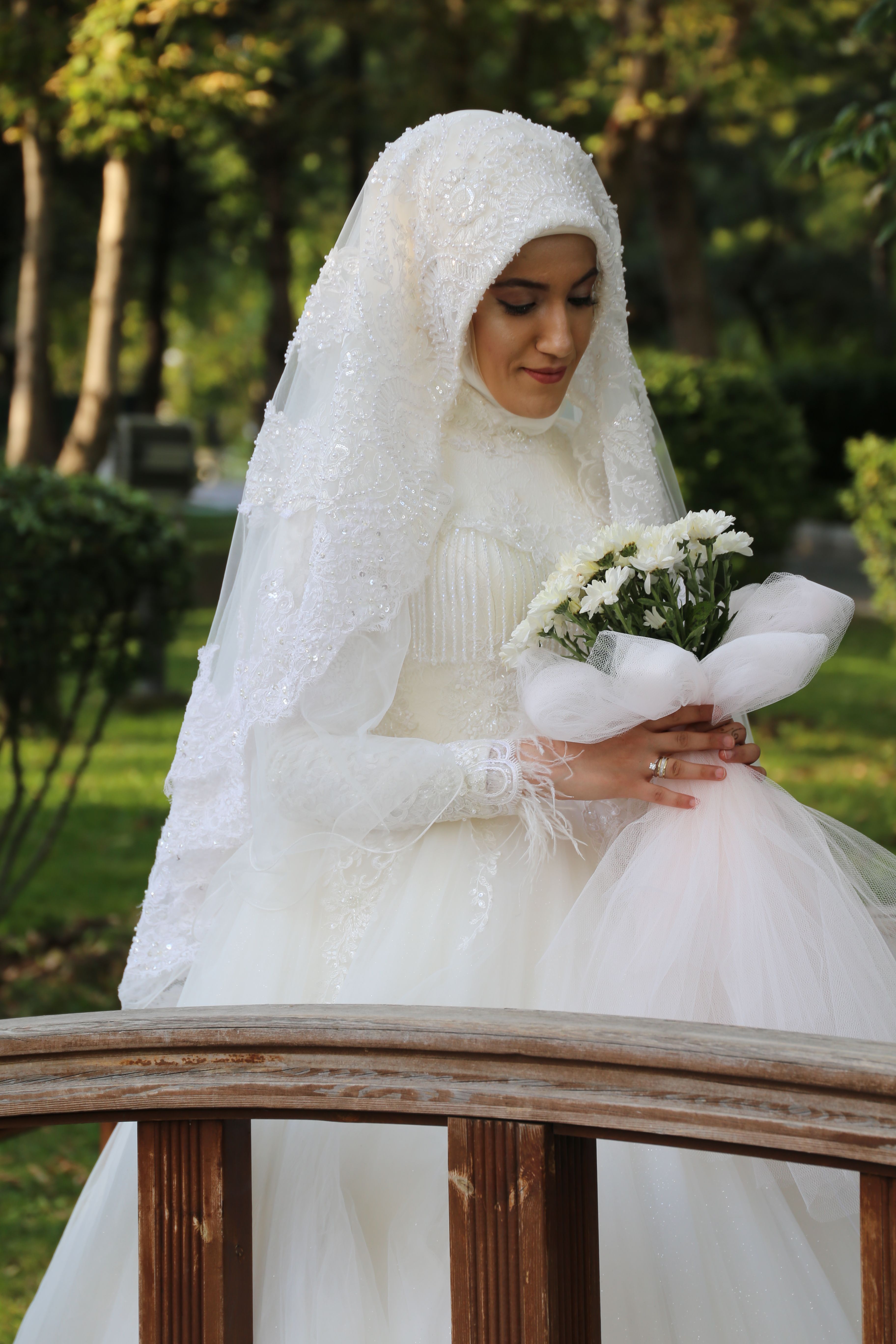 Woman in White Wedding Dress Holding Bouquet of Flowers · Free Stock Photo