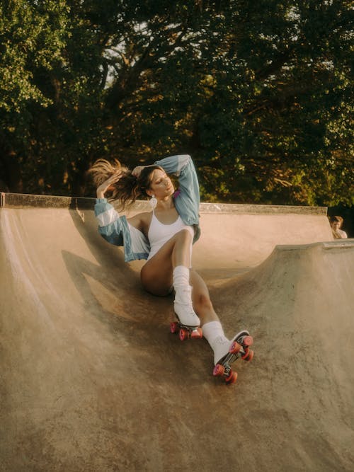 A Woman Sitting on the Skate Park