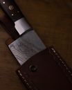 Brown Leather Flip Case on Brown Wooden Table
