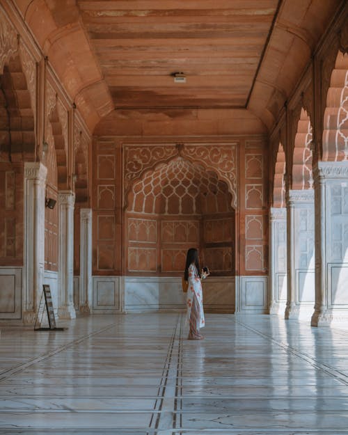 Woman in White Dress Standing on Hallway