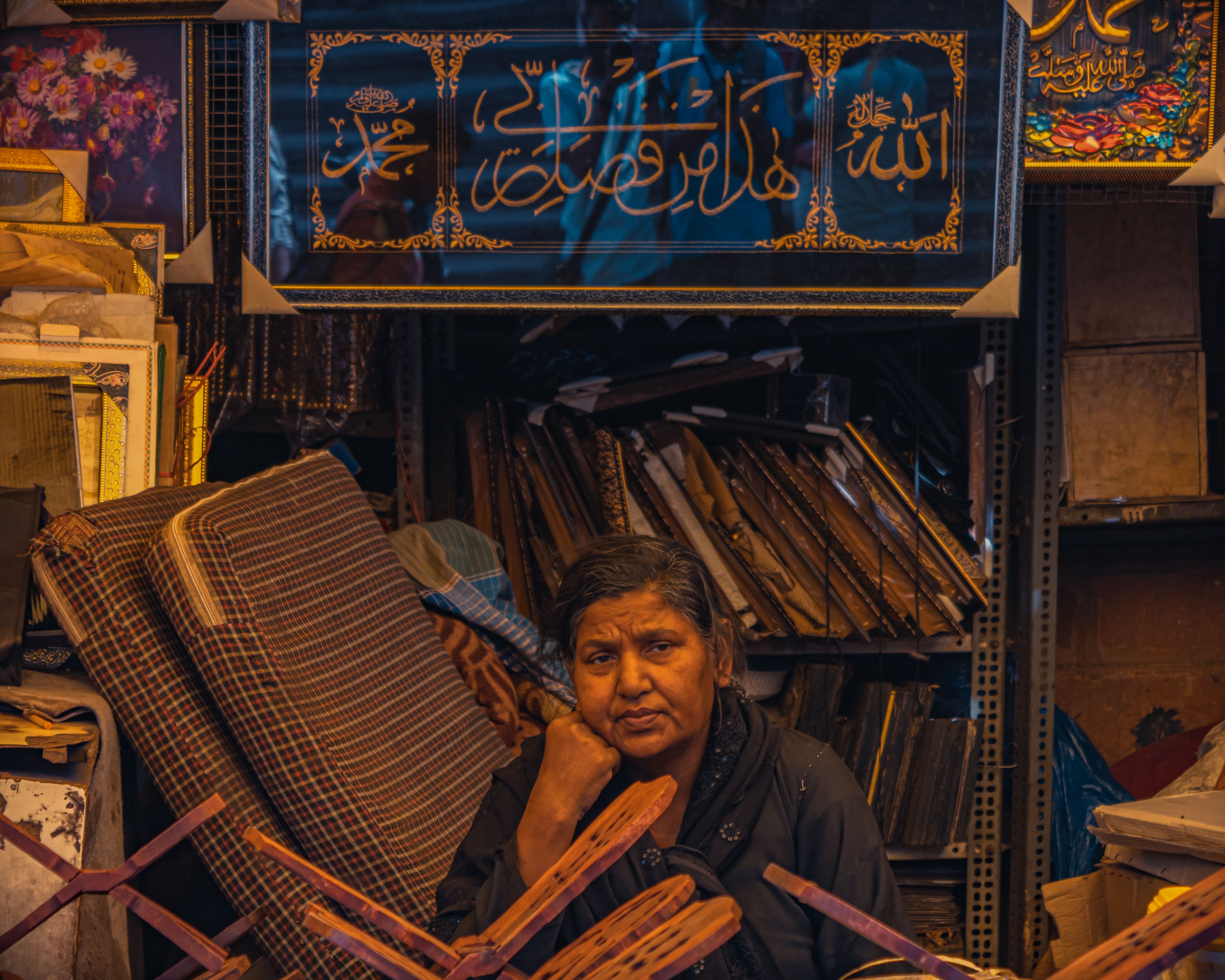 A market stall in Delhi displaying a UPI QR code next to a stack of small rupee notes