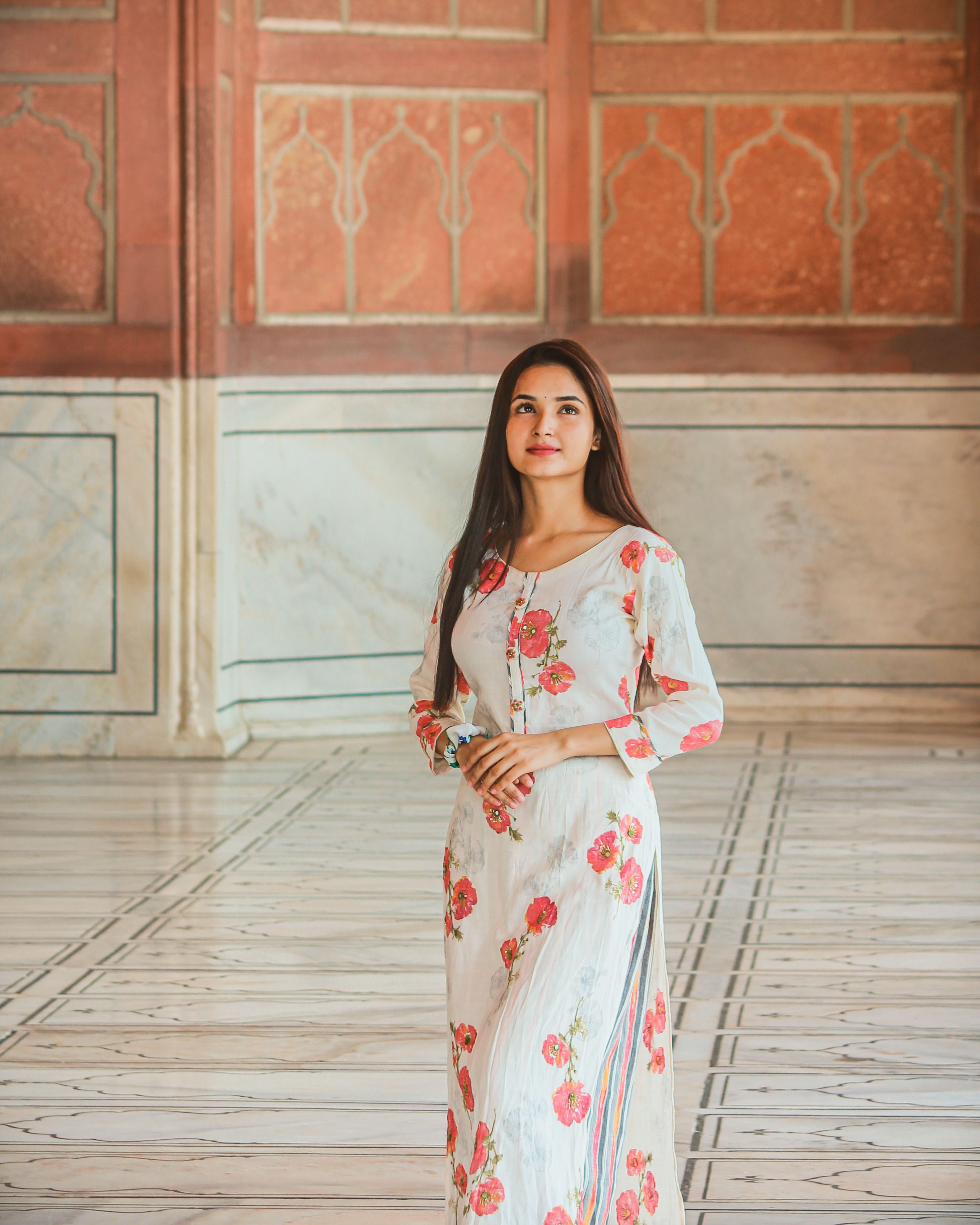 Woman in Floral Patterned Dress Standing in a Room · Free Stock Photo