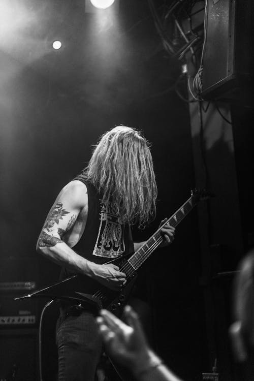 Monochrome Photo of Man playing Electric Guitar