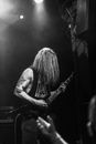 Grayscale Photo of Woman Playing Electric Guitar