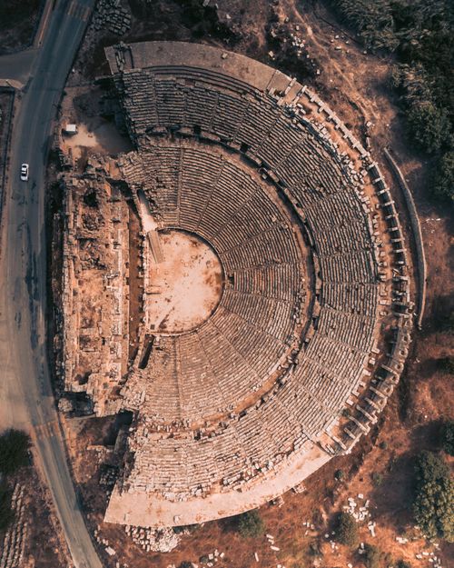 Free Bird's eye view of an ancient Greek theater, showcasing historical architecture. Stock Photo