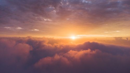 Free Breathtaking sunrise with vibrant clouds capturing the ethereal beauty of dawn skies. Stock Photo