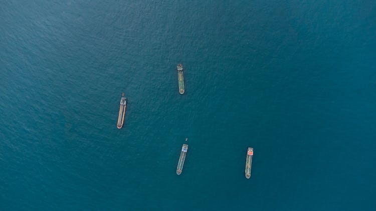 Top View Of Barges On Sea