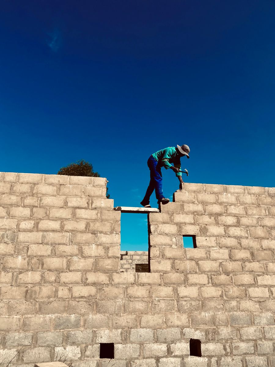 Worker breaking out old concrete