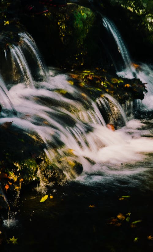 Waterfalls In Between Gray Rocks · Free Stock Photo