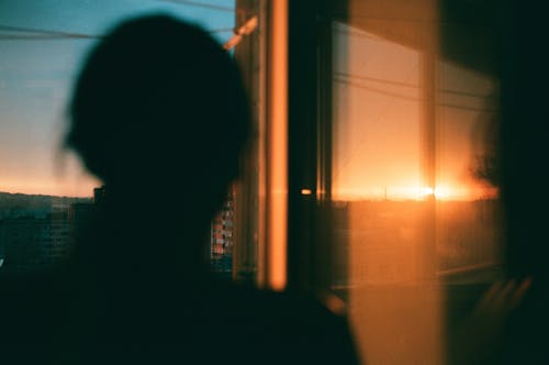 Silhouette of a Person During Sunset