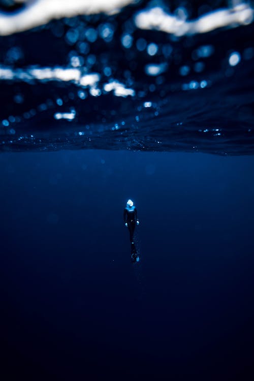 Diver Under Water Surface